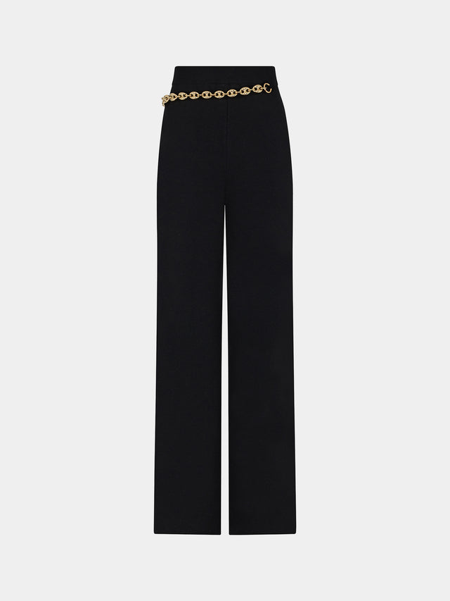Pantalon noir avec chaîne en maillons dorés