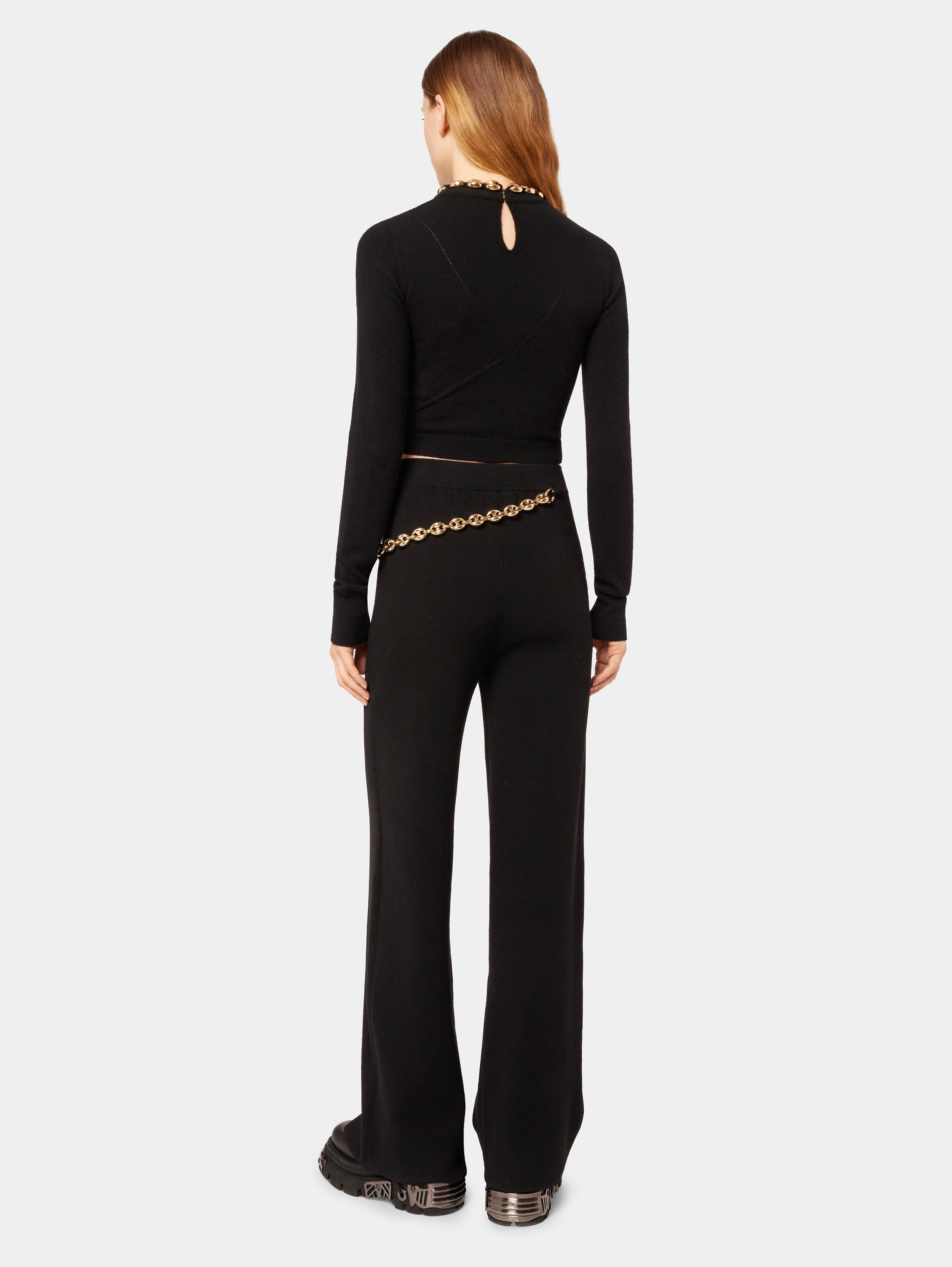 Black trousers with the gold eight chain | Rabanne