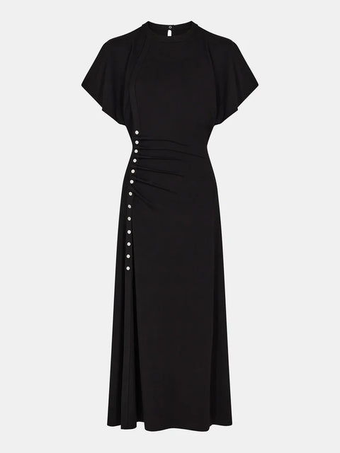 Maxi dress draped with metal buttons