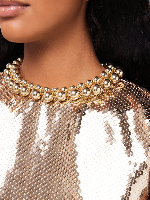 Gold sequins crop top with metallic pearled neckline